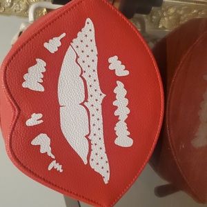Marc Jacobs red lip shaped zipper cosmetic bag.
